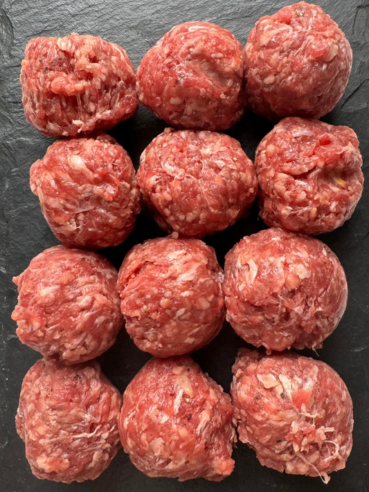 meatballs on a black slate background